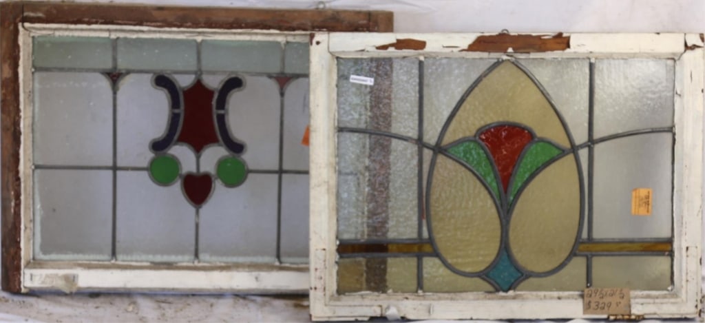 TWO CONTINENTAL STAINED GLASS PANELS: Two Continental stained glass panels with multicolored stained glass medallions. Approximate dimensions: h. 21.5", w. 29.5" Disclaimer: This is an online court ordered bankruptcy sale. Participating b