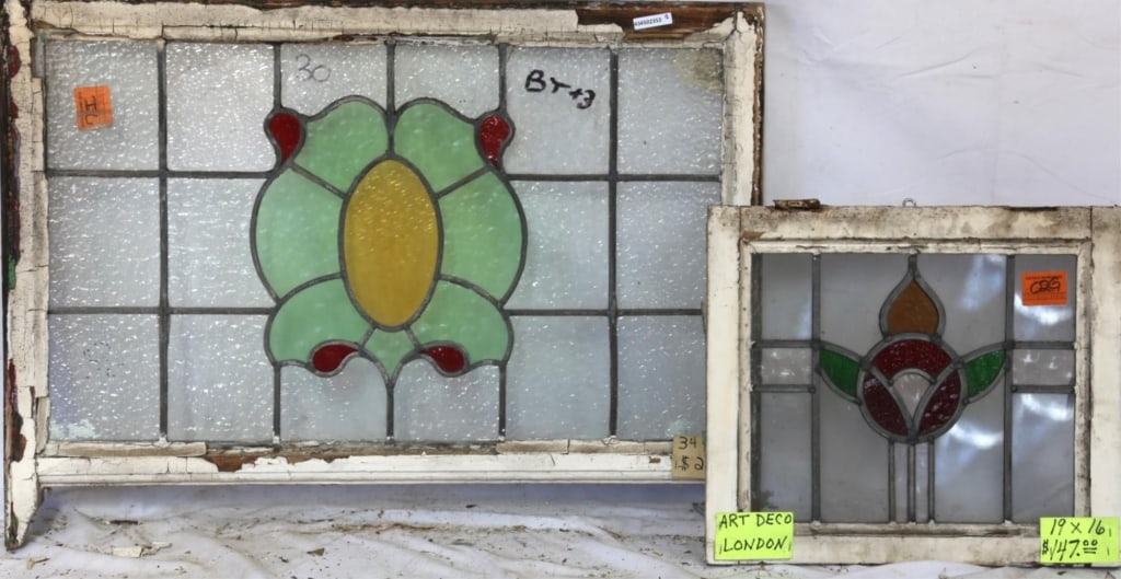 TWO ENGLISH STAINED GLASS PANELS: Two English stained glass panels with multicolored stained glass accents. Approximate dimensions: h. 23", w. 34.5" Disclaimer: This is an online court ordered bankruptcy sale. Participating bidders mu