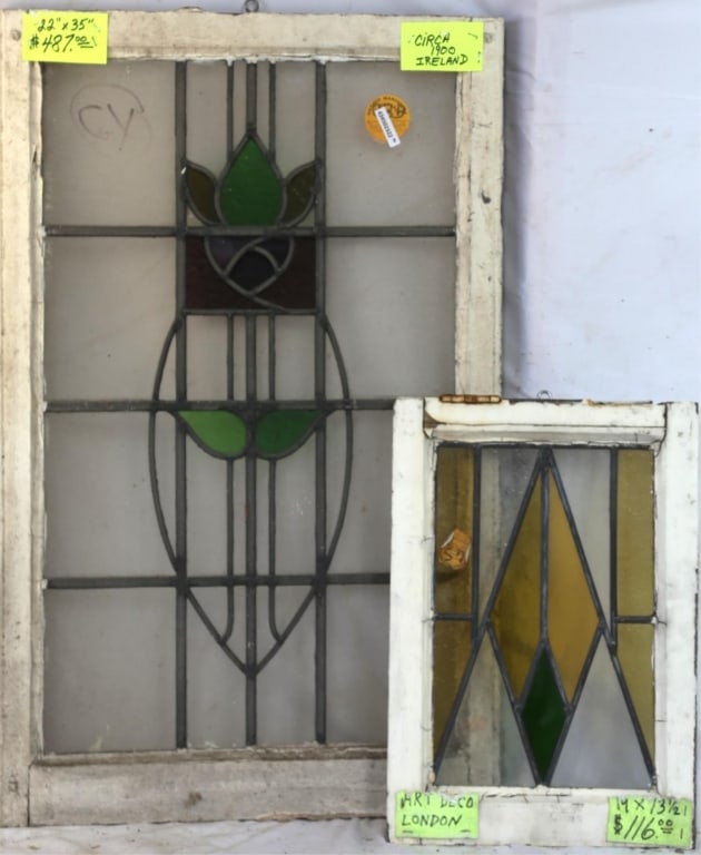 TWO CONTINENTAL STAINED GLASS PANELS: Irish with floral medallion and wispy glass accents, another one is English Art Deco. Approximate dimensions: h. 35", w. 22" Disclaimer: This is an online court ordered bankruptcy sale. Participating