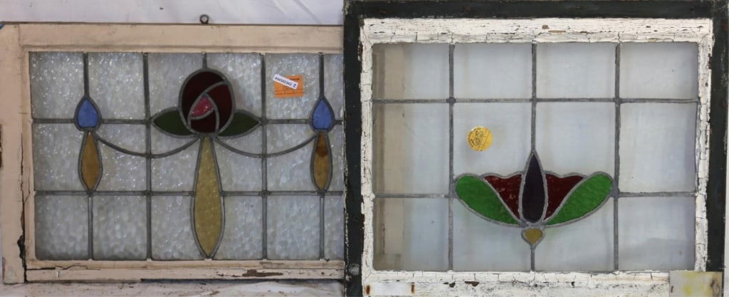 TWO ENGLISH STAINED GLASS PANELS: Two English stained glass panels with elaborate multicolored glass accents. Approximate dimensions: h. 21.5", w. 26.5" Disclaimer: This is an online court ordered bankruptcy sale. Participating bidder