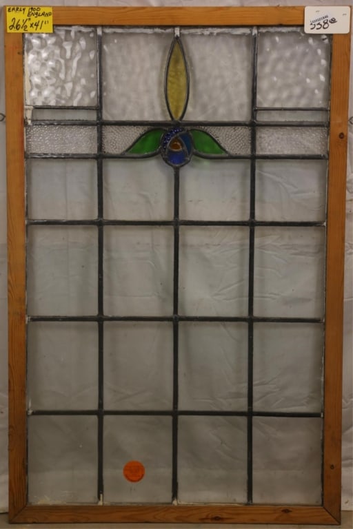 ENGLISH ART NOUVEAU STAINED GLASS PANEL: English Art Nouveau stained glass panel with blue floral medallion, leaves, and amber accent. Approximate dimensions: h. 41", w. 26.5" Disclaimer: This is an online court ordered bankruptcy sale. Part