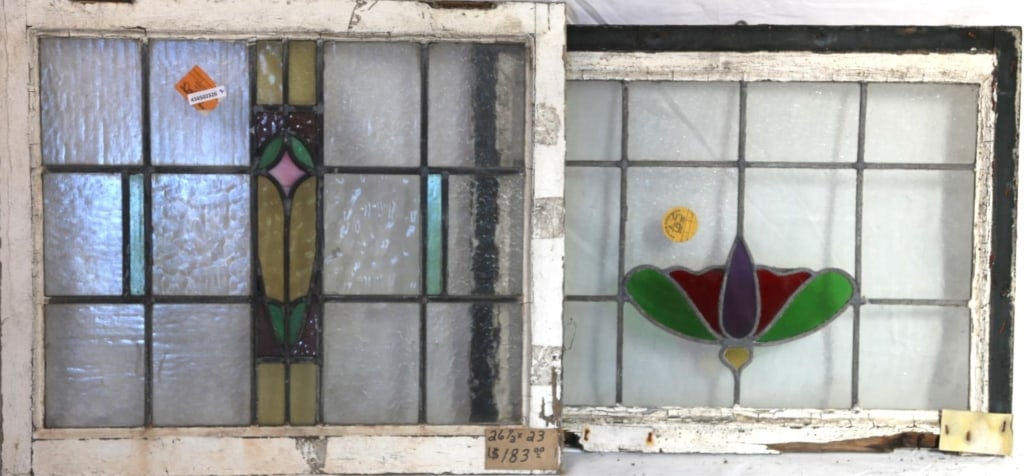 TWO CONTINENTAL STAINED GLASS PANELS: Two Continental stained glass panels with multicolored stained glass accents. Approximate dimensions: h. 23", w. 26.5" Disclaimer: This is an online court ordered bankruptcy sale. Participating bidder