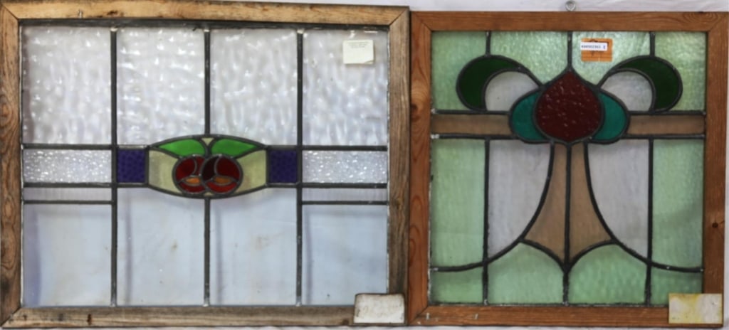 TWO CONTINENTAL STAINED GLASS PANELS: Two Continental stained glass panels with intricate multicolored glass details. Approximate dimensions: h. 22", w. 27" Disclaimer: This is an online court ordered bankruptcy sale. Participating bidder