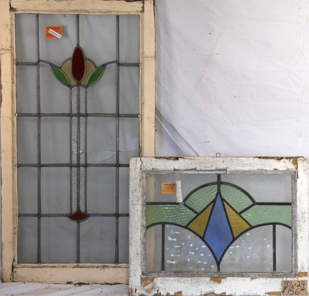 TWO CONTINENTAL STAINED GLASS PANELS: Two Continental stained glass panels with multicolored stained glass accents. Approximate dimensions: h. 39", w. 20.5" Disclaimer: This is an online court ordered bankruptcy sale. Participating bidder
