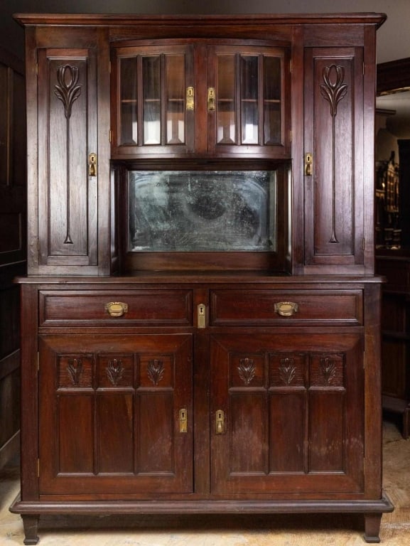 FRENCH ART NOUVEAU VITRINE BUFFET: French Art Nouveau vitrine buffet with beveled glass cabinet, mirrored backsplash, carved details, and block feet. Approximate dimensions: h. 78", w. 55", d. 20" Disclaimer: This is an online court or