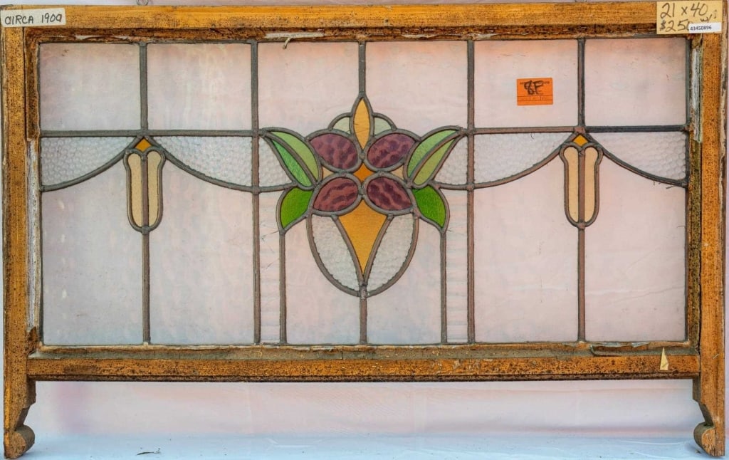 FRENCH ART NOUVEAU STAINED GLASS PANEL: French Art Nouveau stained glass panel with a floral motif, set within textured colorless leaded glass panels. Approximate dimensions: h. 21",w. 40" Disclaimer: This is an online court ordered bankrup