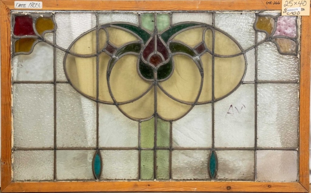 FRENCH ART NOUVEAU STAINED GLASS PANEL: French Art Nouveau stained glass panel with a floral medallion and floral accents at the corners. Approximate dimensions: h. 25", w. 40" Disclaimer: This is an online court ordered bankruptcy sale. Pa