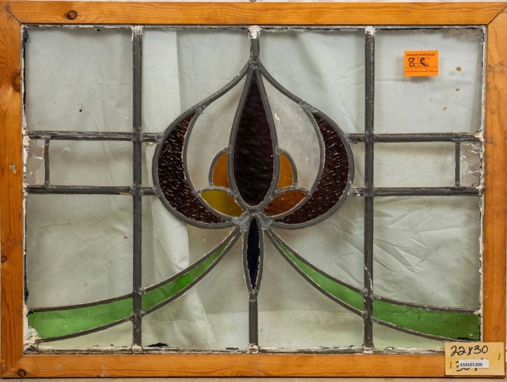 FRENCH ART NOUVEAU STAINED GLASS PANEL: French Art Nouveau stained glass panel with a floral medallion and green garland details. Approximate dimensions: h. 22", w. 30" Disclaimer: This is an online court ordered bankruptcy sale. Participat