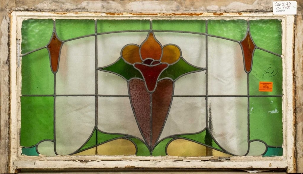 FRENCH ART NOUVEAU STAINED GLASS PANEL: French Art Nouveau stained glass panel with a floral medallion. Approximate dimensions: h. 26", w. 46" Disclaimer: This is an online court ordered bankruptcy sale. Participating bidders must have a cr