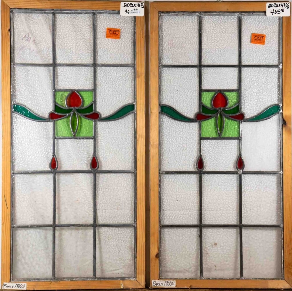 PAIR OF FRENCH ART NOUVEAU STAINED GLASS PANELS: Pair of French Art Nouveau stained glass panels with a floral medallion and red drop-shaped details. Approximate dimensions: h. 41", w. 20.5" Disclaimer: This is an online court ordered bankruptcy sal