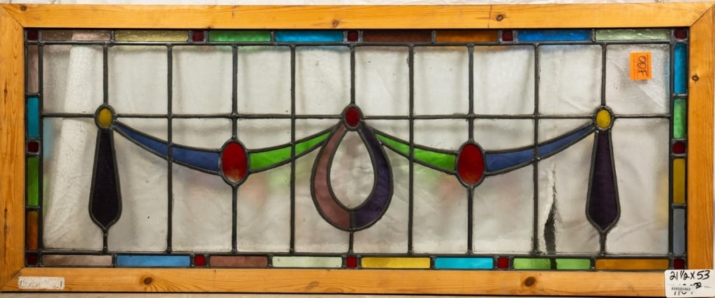 FRENCH ART NOUVEAU STAINED GLASS PANEL: French Art Nouveau stained glass panel with a garland motif and multicolored stained glass accents. Approximate dimensions: h. 21.5", w. 53" Disclaimer: This is an online court ordered bankruptcy sale