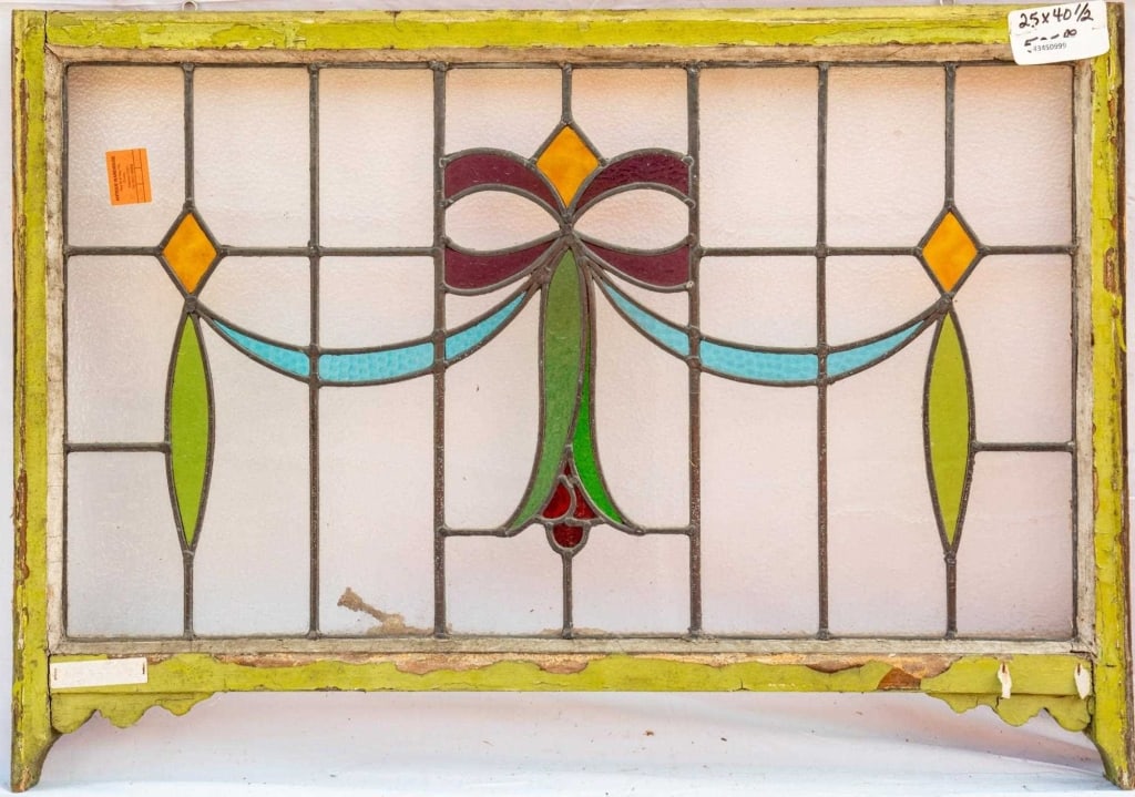 FRENCH ART NOUVEAU STAINED GLASS PANEL: French Art Nouveau stained glass panel with a floral, bow, and ribbon motif in a green wooden frame. Approximate dimensions: h. 25", w. 40.5" Disclaimer: This is an online court ordered bankruptcy sal