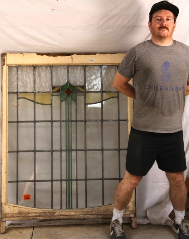 ANTIQUE CONTINENTAL STAINED GLASS PANEL: Antique Continental stained glass panel with a multicolored stained glass medallion. Approximate dimensions: h. 53", w. 40" Disclaimer: This is an online court ordered bankruptcy sale. Participating b