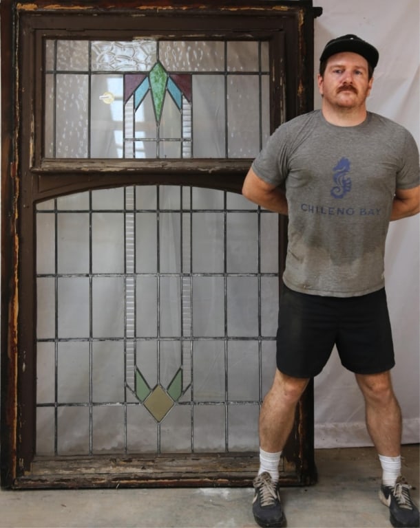 FRENCH ART DECO STAINED GLASS PANEL: French Art Deco stained glass panel with multicolored geometric elements and colorless leaded glass panels. Approximate dimensions: h. 72.5", w. 46" Disclaimer: This is an online court ordered bankrup