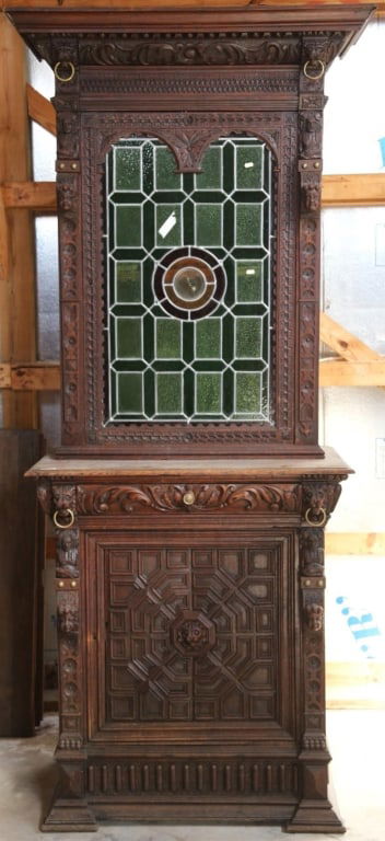 FRENCH RENAISSANCE REVIVAL STAINED GLASS BUFFET: French Renaissance Revival stained glass buffet with a stained glass panel with a jeweled central detail, lion and brass ring accents, and elaborate carving throughout. Approximate dimensions: h. 94.5