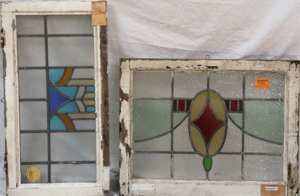 PAIR OF ANTIQUE ENGLISH STAINED GLASS PANELS: Pair of antique English stained glass panels with geometric medallions. Approximate dimensions: h. 21", w. 27" Disclaimer: This is an online court ordered bankruptcy sale. Participating bidders must h