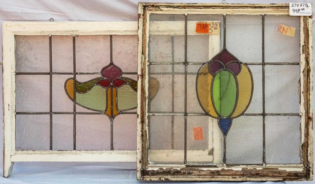 TWO FRENCH STAINED GLASS PANELS: Two French stained glass panels with multicolored abstract medallions. Approximate dimensions: h. 22", w. 35" Disclaimer: This is an online court ordered bankruptcy sale. Participating bidders must ha