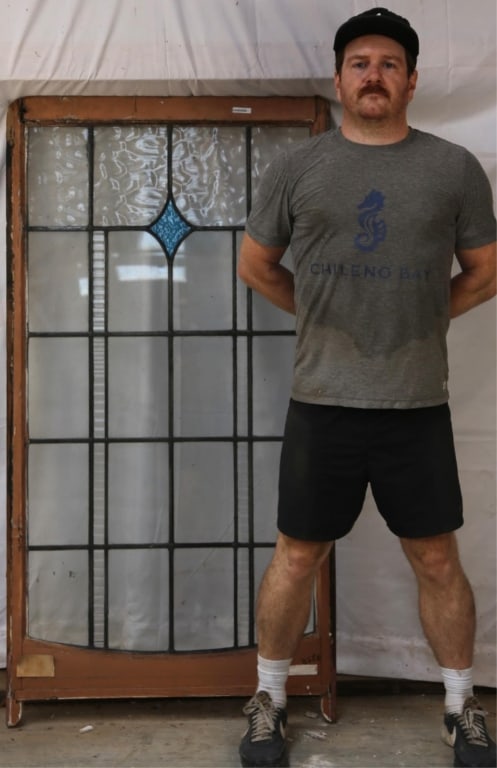 ANTIQUE CONTINENTAL STAINED GLASS PANEL: Antique Continental stained glass panel with a blue rhombic medallion and colorless leaded glass panels. Approximate dimensions: h. 60", w. 32" Disclaimer: This is an online court ordered bankruptcy s