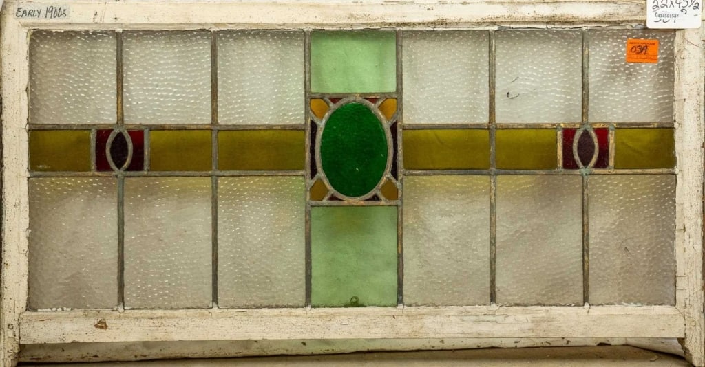 ENGLISH ART DECO STAINED GLASS PANEL: English Art Deco stained glass panel with geometric accents. Approximate dimensions: h. 22", w. 45.5" Disclaimer: This is an online court ordered bankruptcy sale. Participating bidders must have a cre