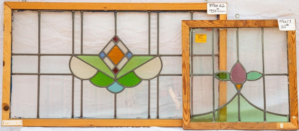 TWO FRENCH STAINED GLASS PANELS: Two French stained glass panels with floral medallions. Approximate dimensions: h. 22", w. 39.5" Disclaimer: This is an online court ordered bankruptcy sale. Participating bidders must have a credit c