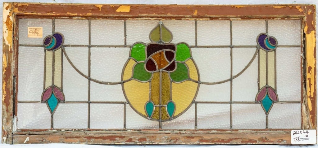 FRENCH ART NOUVEAU STAINED GLASS PANEL: French Art Nouveau stained glass panel with a floral medallion. Approximate dimensions: h. 20", w. 44" Disclaimer: This is an online court ordered bankruptcy sale. Participating bidders must have a cr