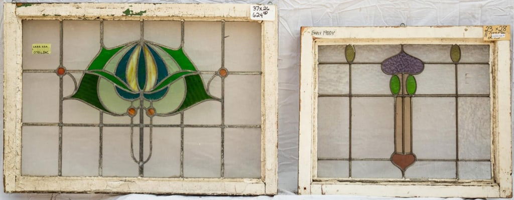 TWO FRENCH ART NOUVEAU STAINED GLASS PANELS: Two French Art Nouveau stained glass panels with floral motif set within colorless leaded glass panels. Approximate dimensions: h. 26", w. 37" Disclaimer: This is an online court ordered bankruptcy sa
