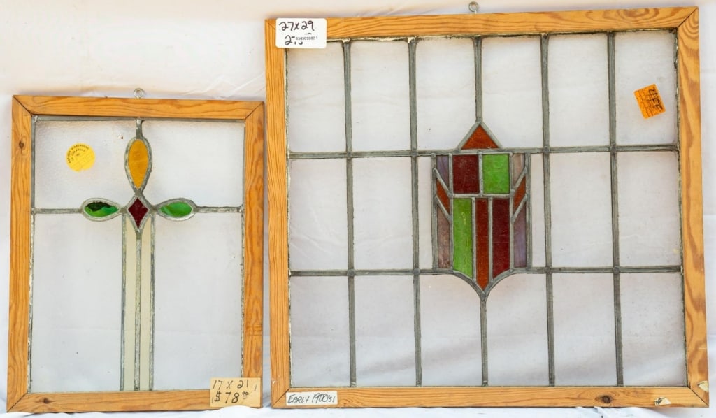 TWO FRENCH STAINED GLASS PANELS: Two French stained glass panels, one with a shield-shaped medallion. Approximate dimensions: h. 27", w. 29" Disclaimer: This is an online court ordered bankruptcy sale. Participating bidders must have