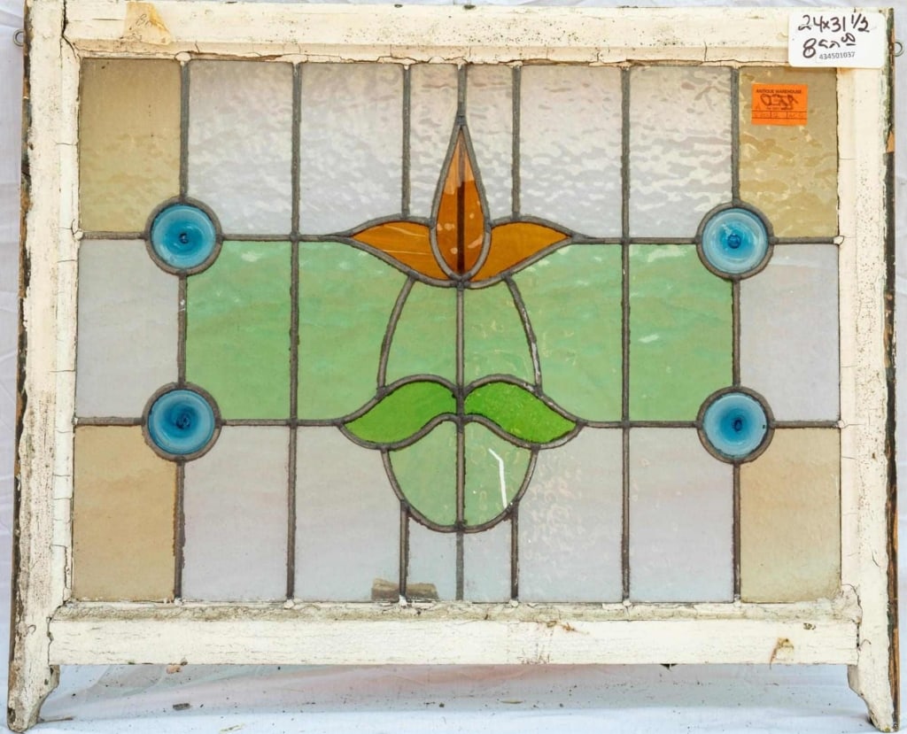 FRENCH ART NOUVEAU JEWELED STAINED GLASS PANEL: French Art Nouveau jeweled stained glass panel with a floral medallion and four blue jeweled accents. Approximate dimensions: h. 24", w. 31.5" Disclaimer: This is an online court ordered bankruptcy sa