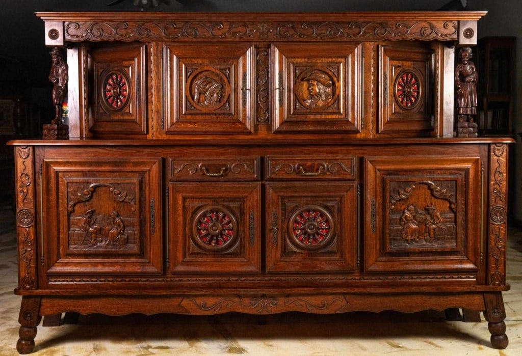 FRENCH RENAISSANCE REVIVAL FIGURAL CARVED BUFFET: French Renaissance Revival figural carved buffet with figural columns, fabric accents, and inset carved panels. Approximate dimensions: h. 66", w. 97", d. 22" Disclaimer: This is an online court order