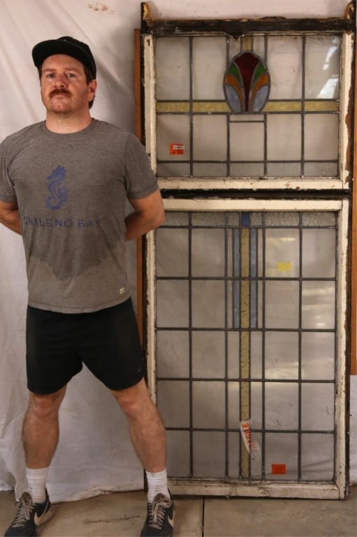 ANTIQUE ENGLISH STAINED GLASS PANEL: Antique English stained glass panel with geometric medallion and colorless leaded glass panels. Approximate dimensions: h. 71", w. 30" Disclaimer: This is an online court ordered bankruptcy sale. Part