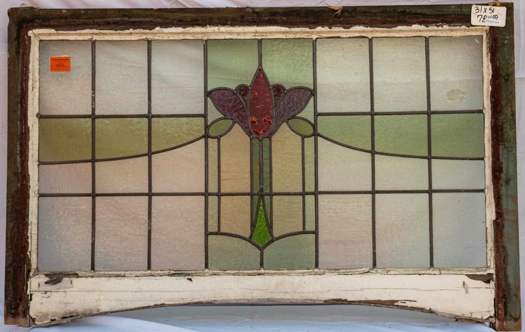 FRENCH ART NOUVEAU STAINED GLASS PANEL: French Art Nouveau stained glass panel with purple and red tulip detail and green stained glass accents. Approximate dimensions: h. 31", w. 51" Disclaimer: This is an online court ordered bankruptcy s