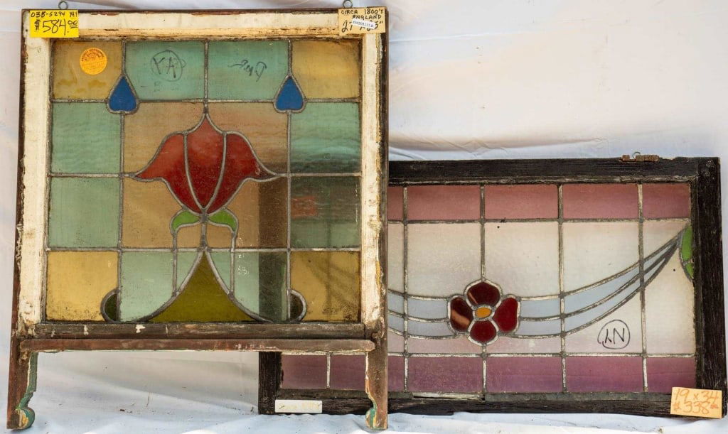 TWO FRENCH ART NOUVEAU STAINED GLASS PANELS: Two French Art Nouveau stained glass panels: one with floral and ribbon motif, and one with floral and heart motif. Approximate dimensions: h. 19", w. 24" Disclaimer: This is an online court ordered b