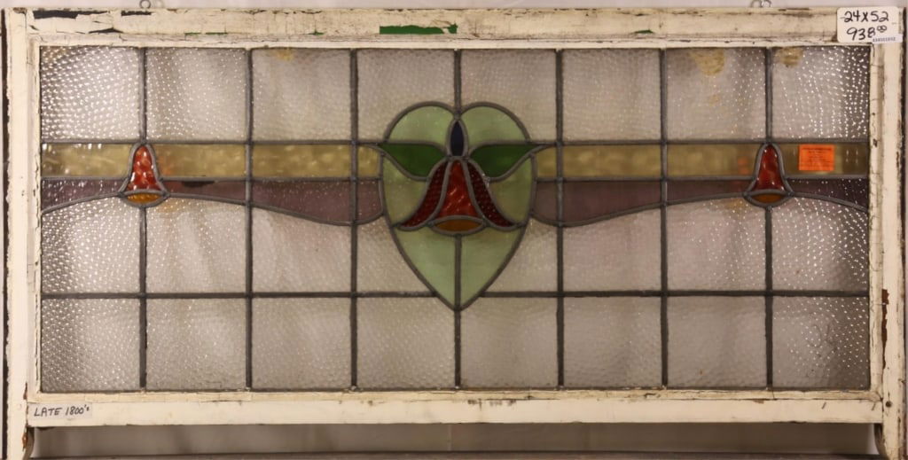 FRENCH ART NOUVEAU STAINED GLASS PANEL: French Art Nouveau stained glass panel with heart-shaped floral motif medallion. Approximate dimensions: h. 24", w. 52" Disclaimer: This is an online court ordered bankruptcy sale. Participating bidde