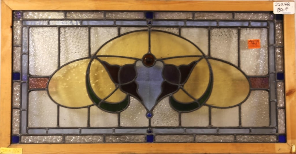 FRENCH ART NOUVEAU JEWELED STAINED GLASS PANEL: French Art Nouveau jeweled stained glass panel with multicolored jeweled accents on the medallion. Approximate dimensions: h. 25", w. 48" Disclaimer: This is an online court ordered bankruptcy sale. P