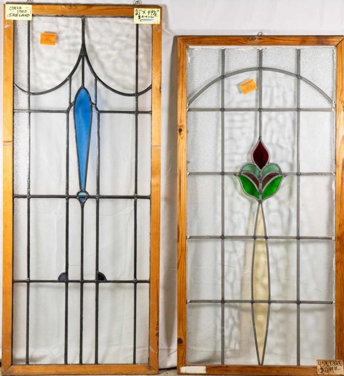 TWO CONTINENTAL ART NOUVEAU STAINED GLASS PANELS: Two Continental Art Nouveau stained glass panels with multicolored stained glass accents. Approximate dimensions: h. 49.5", w. 21" Disclaimer: This is an online court ordered bankruptcy sale. Particip