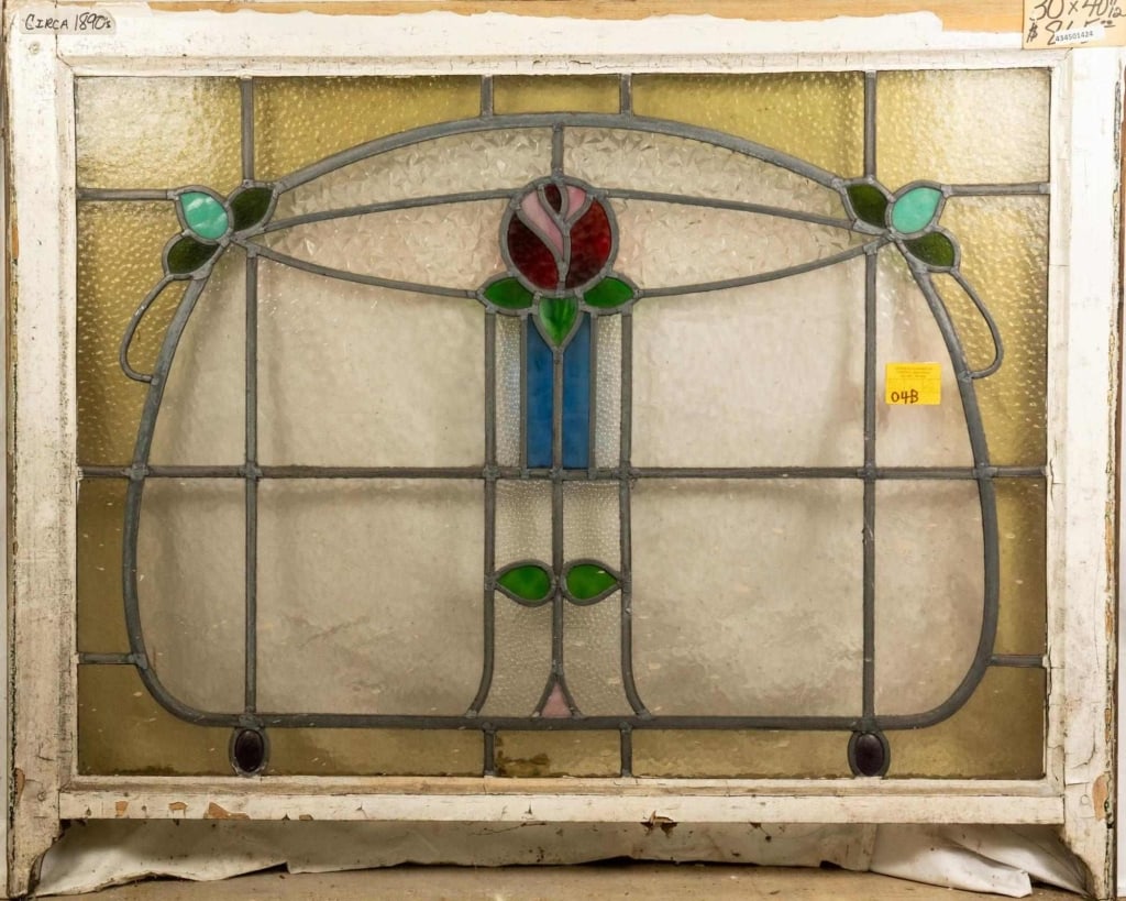 FRENCH ART NOUVEAU STAINED GLASS PANEL: French Art Nouveau stained glass panel, rose and leaf medallion with blue floral accents on the sides. Approximate dimensions: h. 30", w. 40.5" Disclaimer: This is an online court ordered bankruptcy s