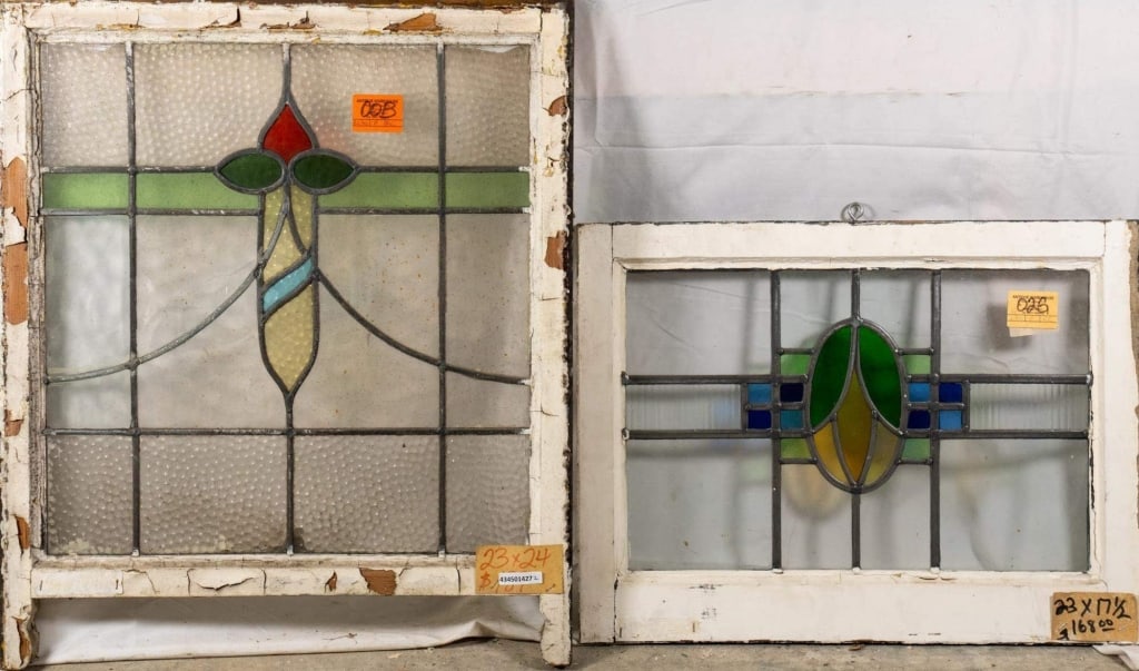 TWO ANTIQUE CONTINENTAL STAINED GLASS PANELS: Two antique Continental stained glass panels with multicolored accents. Approximate dimensions: h. 24", w. 23" Disclaimer: This is an online court ordered bankruptcy sale. Participating bidders must h