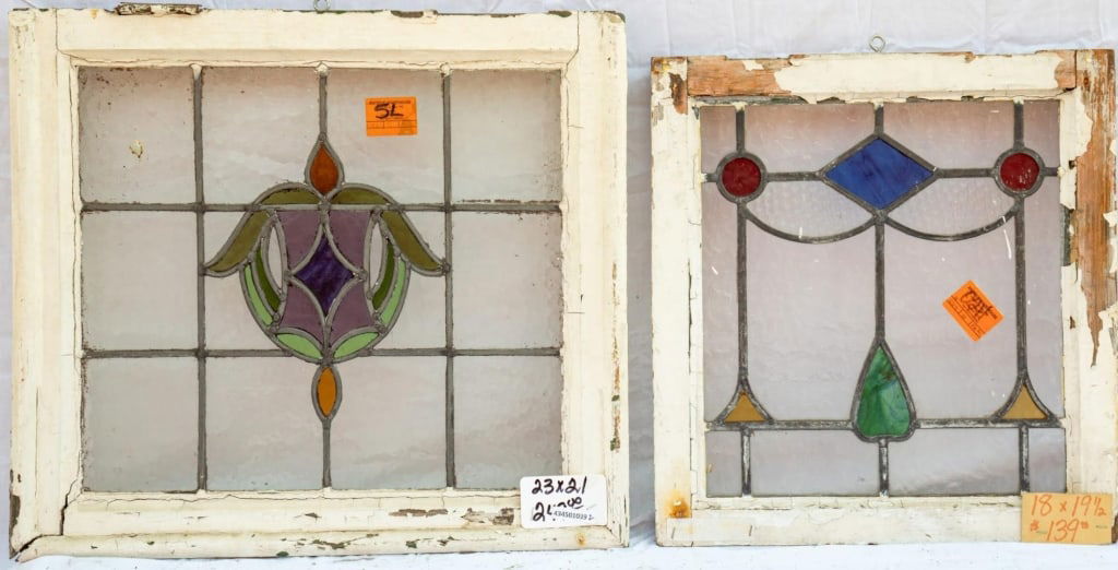 TWO FRENCH ART NOUVEAU STAINED GLASS PANELS: Two French Art Nouveau stained glass panels with multicolored stained glass insets. Approximate dimensions: h. 21", w. 23" Disclaimer: This is an online court ordered bankruptcy sale. Participating bi