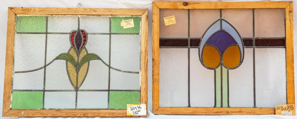 TWO FRENCH ART NOUVEAU STAINED GLASS PANELS: Two French Art Nouveau stained glass panels with multicolored leaded glass panels and floral medallions. Approximate dimensions: h. 20.5", w. 25.5" Disclaimer: This is an online court ordered bankrupt
