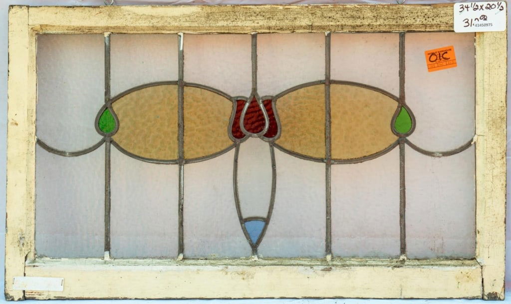 FRENCH ART NOUVEAU STAINED GLASS PANEL: French Art Nouveau stained glass panel with a floral motif. Approximate dimensions: h. 20.5", w. 34.5" Disclaimer: This is an online court ordered bankruptcy sale. Participating bidders must have a cr