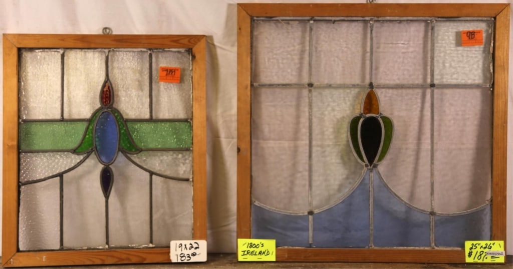 TWO ANTIQUE IRISH STAINED GLASS PANELS: Two antique Irish stained glass panels with floral motif medallions and blue and green accents. Approximate dimensions: h. 25", w. 26" Disclaimer: This is an online court ordered bankruptcy sale. Part