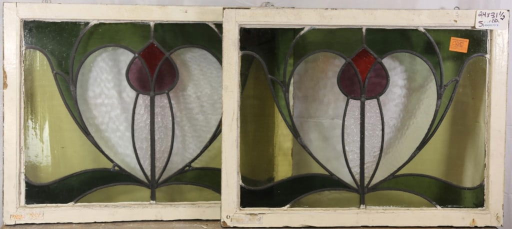 PAIR OF FRENCH ART NOUVEAU STAINED GLASS PANELS: Pair of French Art Nouveau stained glass panels with floral medallion and elaborate botanical motif elements. Approximate dimensions: h. 24", w. 31.5" Disclaimer: This is an online court ordered bankr