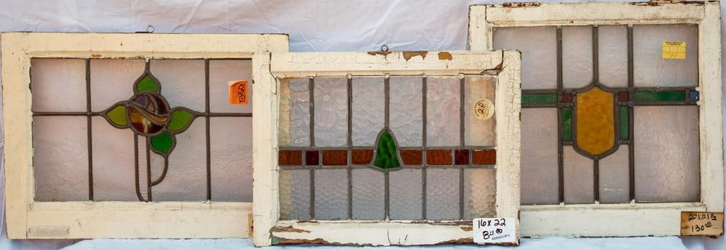 THREE FRENCH STAINED GLASS PANELS: Three French stained glass panels with multicolored medallion. Approximate dimensions: h. 21.5", w. 20" Disclaimer: This is an online court ordered bankruptcy sale. Participating bidders must have a c