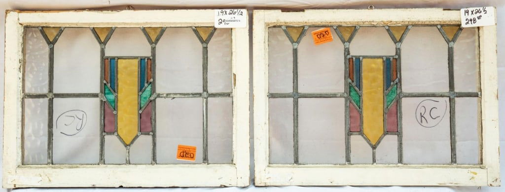 PAIR OF FRENCH STAINED GLASS PANELS: Pair of French stained glass panels with geometric multicolored stained glass medallions. Approximate dimensions: h. 19", w. 26.5" Disclaimer: This is an online court ordered bankruptcy sale. Particip