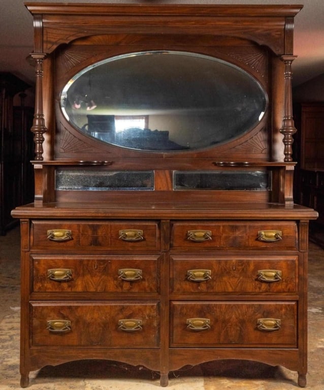 MONUMENTAL FRENCH MAHOGANY DRESSER: Monumental French mahogany dresser with beveled mirror, mirrored backsplash, carved supports, and brass pulls. Approximate dimensions: h. 80", w. 61", d. 20" Disclaimer: This is an online court ordere