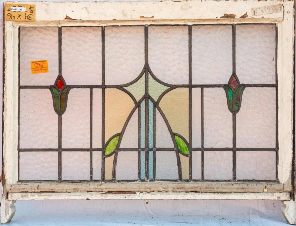 FRENCH ART NOUVEAU STAINED GLASS PANEL: French Art Nouveau stained glass panel with a floral motif. Approximate dimensions: h. 34", w. 46" Disclaimer: This is an online court ordered bankruptcy sale. Participating bidders must have a credit