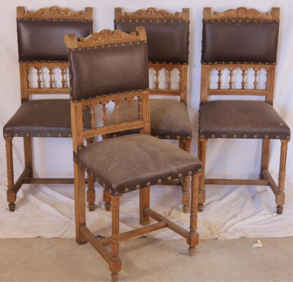 SET OF 4 FRENCH RENAISSANCE REVIVAL DINING CHAIRS: Set of four French Renaissance Revival dining chairs, with carved crest and details to the back and legs, stretcher bases, and nailhead trim accents. Approximate dimensions: h. 37", w. 17", d. 15.5" D