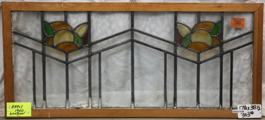 ANTIQUE ENGLISH STAINED GLASS PANEL: Antique English stained glass panel with half-sphere floral motif. Approximate dimensions: h. 17.5", w. 38.5" Disclaimer: This is an online court ordered bankruptcy sale. Participating bidders must ha
