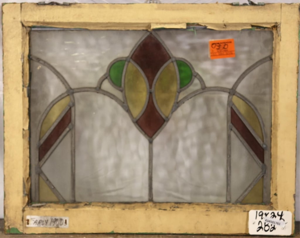 ANTIQUE CONTINENTAL STAINED GLASS PANEL: Antique Continental stained glass panel with red, green, and yellow stained glass details. Approximate dimensions: h. 19", w. 24" Disclaimer: This is an online court ordered bankruptcy sale. Participa