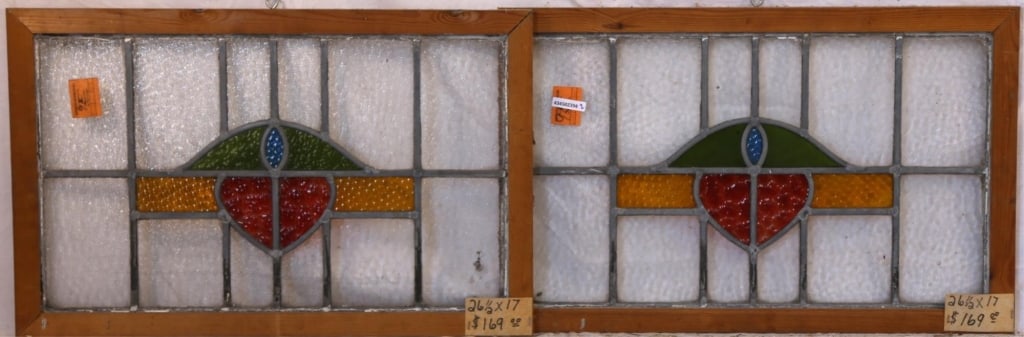 PAIR OF IRISH STAINED GLASS PANELS: Pair of Irish stained glass panels with abstract multicolored medallions and intricately textured details Approximate dimensions: h. 17", w. 26.5" Disclaimer: This is an online court ordered bankruptc